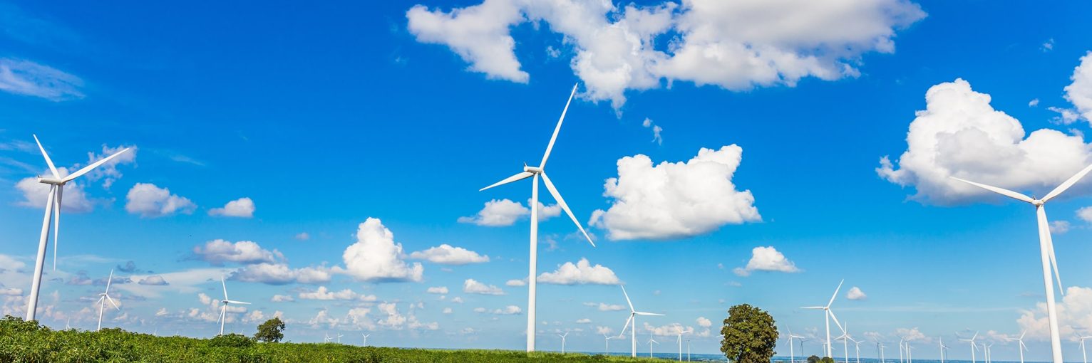 Wind turbine farm in beautiful nature with blue sky blackground, generating electricity in Nakorn Ratchasima Thailand